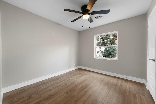 unfurnished room with hardwood / wood-style floors and ceiling fan