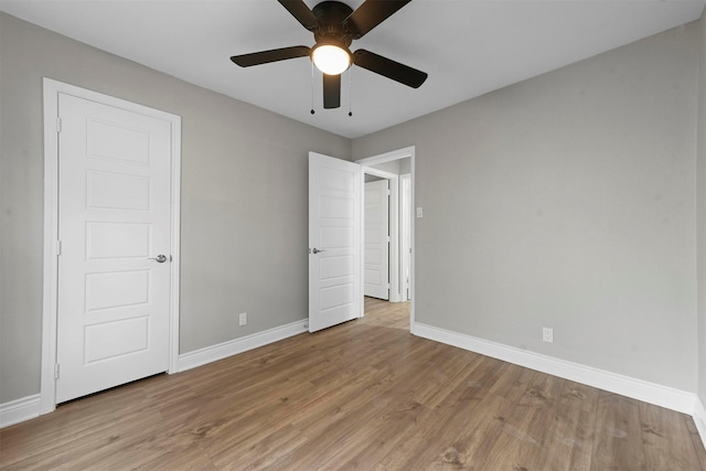 unfurnished bedroom featuring light hardwood / wood-style flooring and ceiling fan