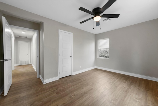 unfurnished bedroom with hardwood / wood-style flooring and ceiling fan