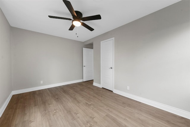 empty room featuring ceiling fan and light wood-type flooring