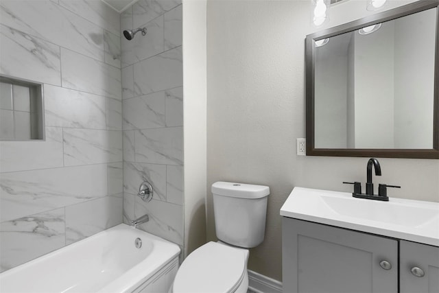 full bathroom with vanity, toilet, and tiled shower / bath