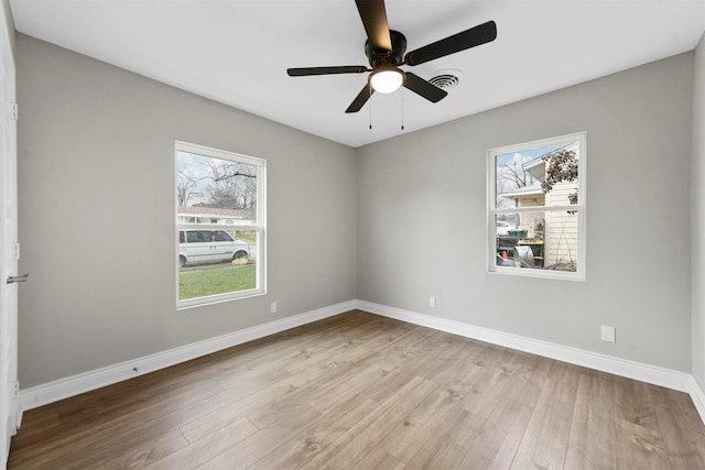 unfurnished room with ceiling fan and light hardwood / wood-style floors