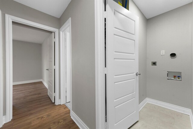 laundry room with hookup for a washing machine, hookup for an electric dryer, and light wood-type flooring