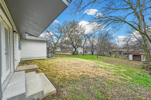 view of yard with a storage shed