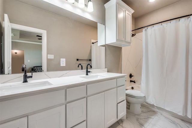 full bathroom featuring shower / bath combo, vanity, and toilet