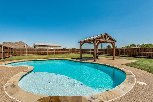 view of swimming pool featuring a gazebo and a lawn