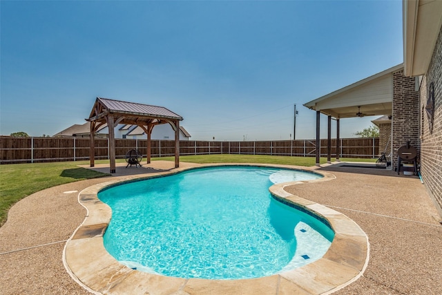 view of swimming pool with a gazebo, a yard, ceiling fan, and a patio area