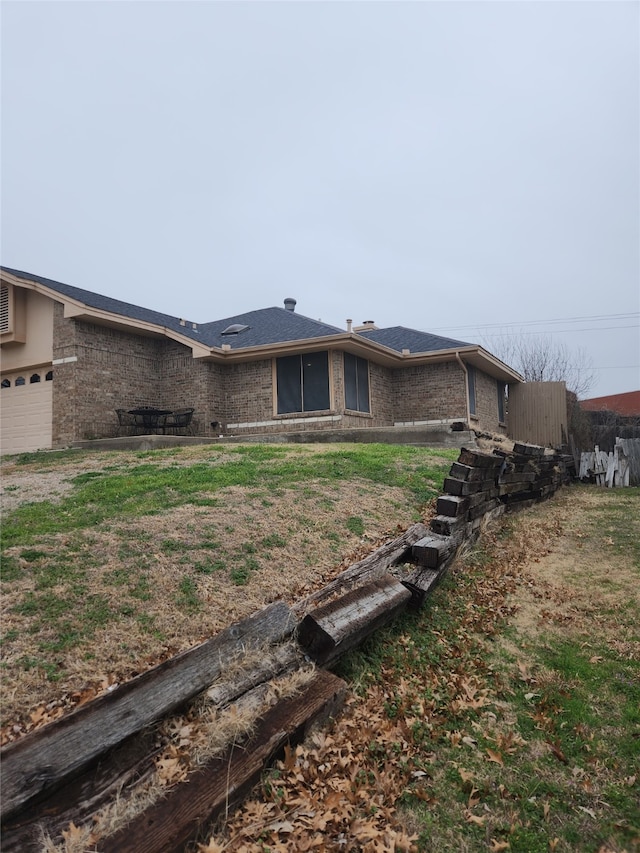 rear view of house with a garage