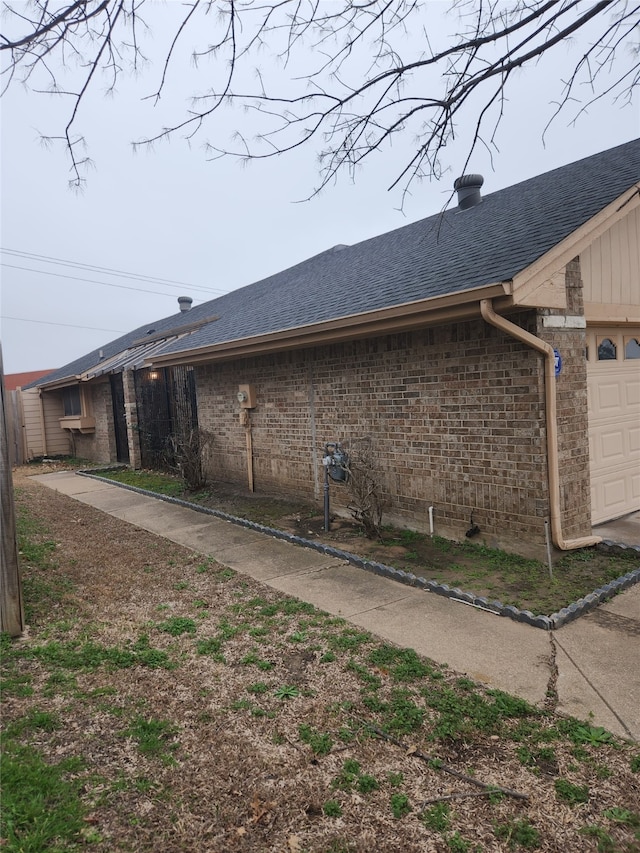 view of property exterior featuring a garage