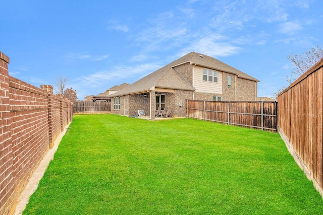 back of house featuring a lawn