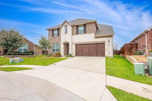 view of front of home featuring a garage and a front yard