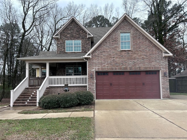 view of front facade featuring a garage and covered porch