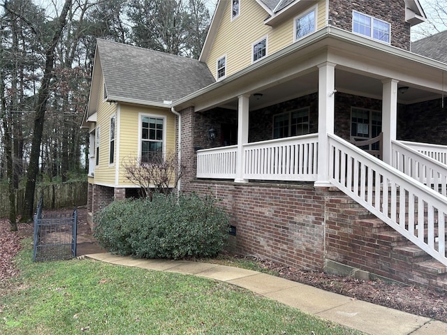 view of property exterior featuring covered porch