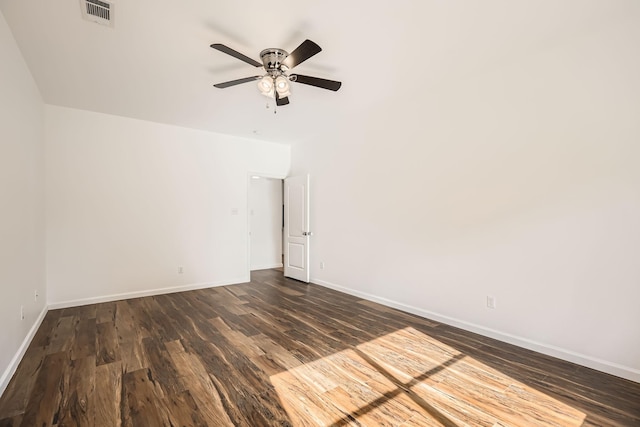 unfurnished room with ceiling fan and dark hardwood / wood-style flooring