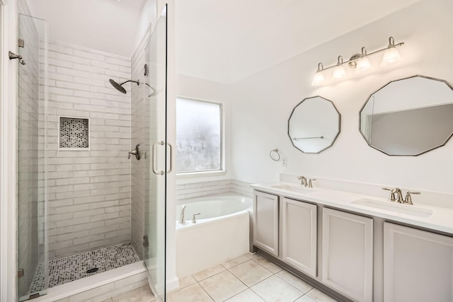 bathroom with tile patterned flooring, vanity, and separate shower and tub