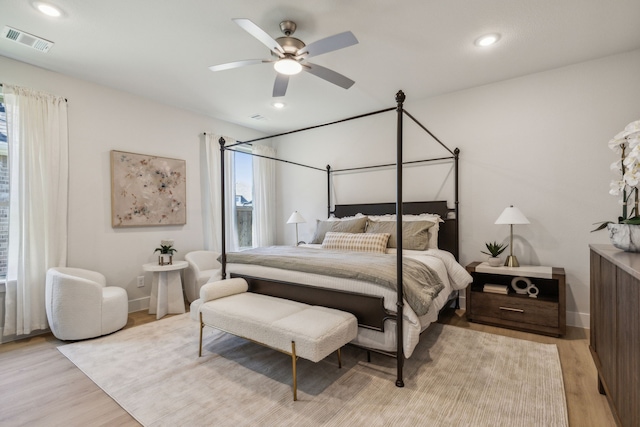 bedroom featuring light hardwood / wood-style flooring and ceiling fan