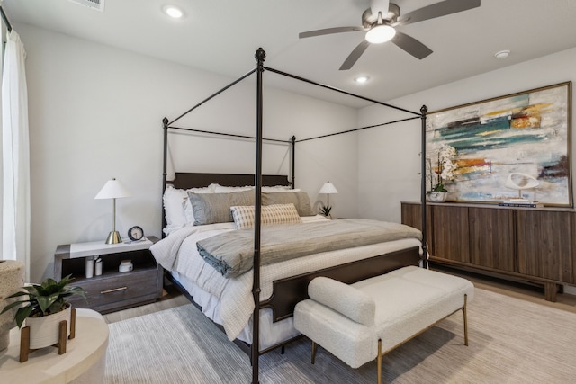 bedroom featuring ceiling fan and light hardwood / wood-style flooring