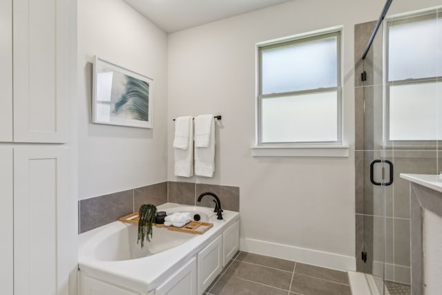 bathroom with tile patterned floors and plus walk in shower