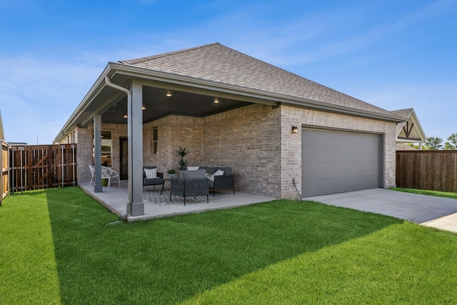 back of house with a patio area and a lawn