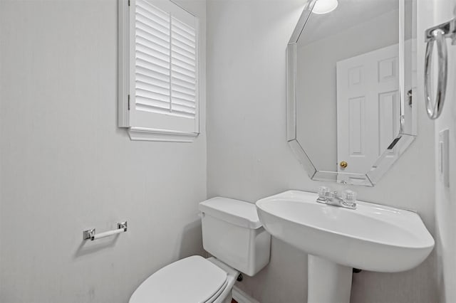 bathroom featuring sink and toilet