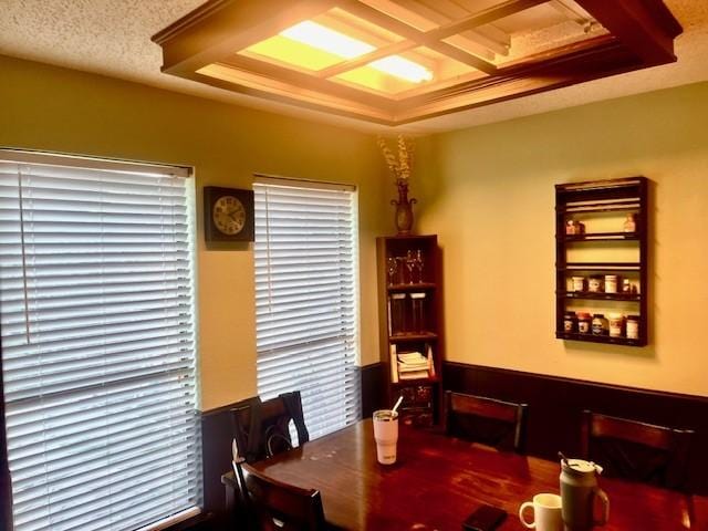 dining space featuring a textured ceiling