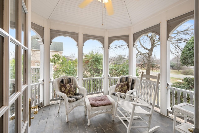 sunroom featuring ceiling fan