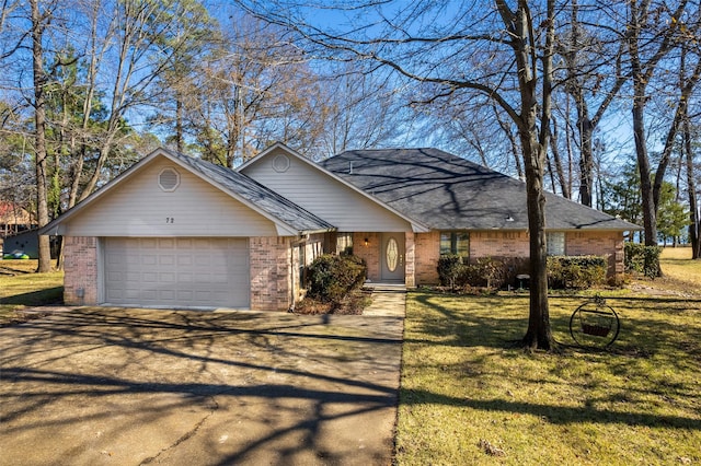 view of front of home with a garage and a front yard