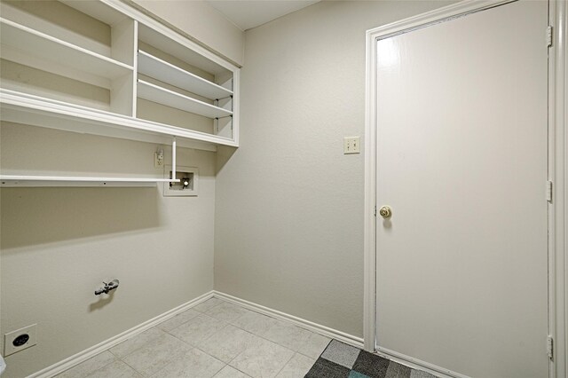 laundry room featuring gas dryer hookup, laundry area, washer hookup, baseboards, and electric dryer hookup