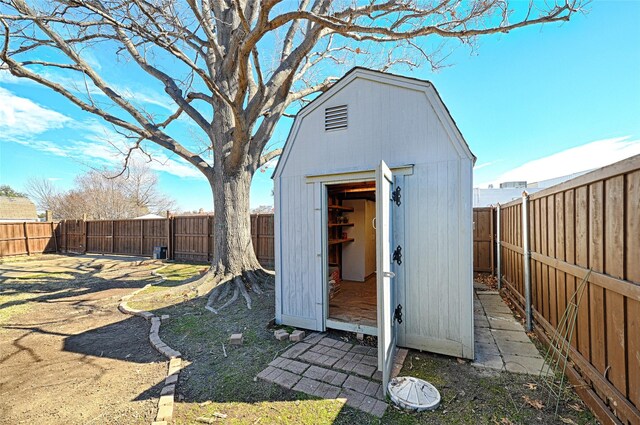 view of shed with a fenced backyard