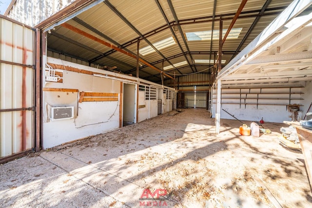 view of horse barn featuring a wall mounted air conditioner