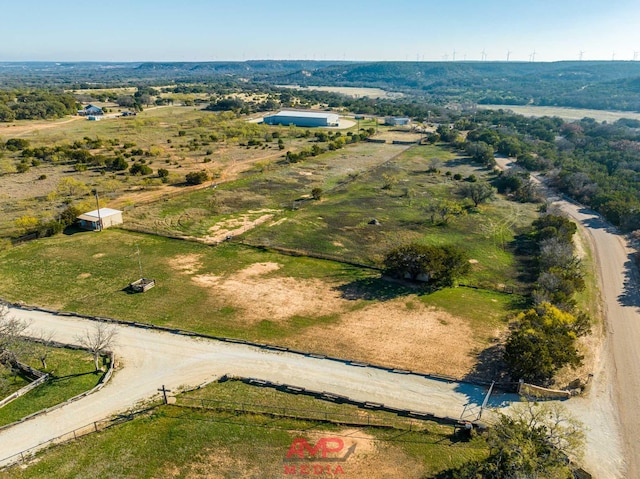 birds eye view of property featuring a rural view