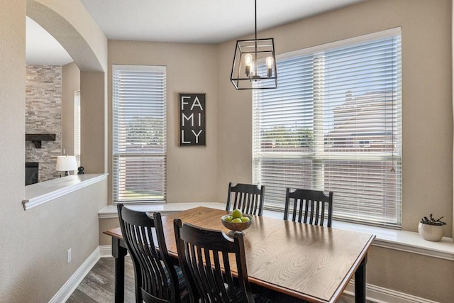 dining space featuring a chandelier, hardwood / wood-style floors, and a wealth of natural light