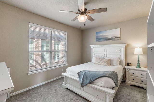 bedroom with ceiling fan and light carpet