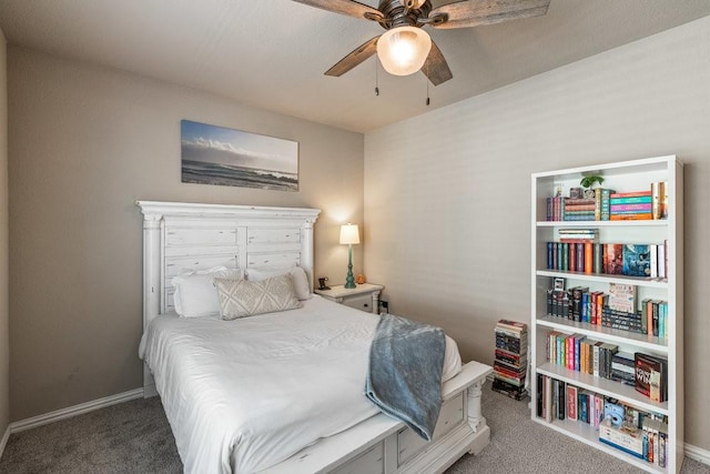 bedroom featuring ceiling fan and carpet