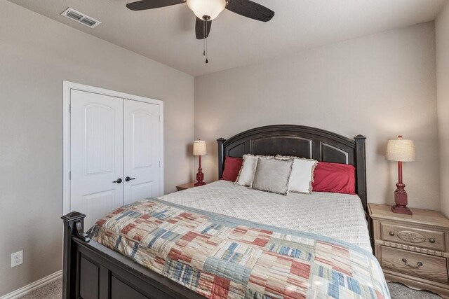 carpeted bedroom with a closet and ceiling fan