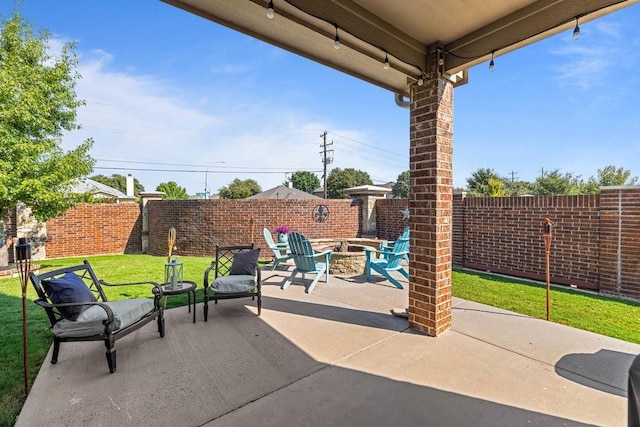 view of patio with an outdoor fire pit