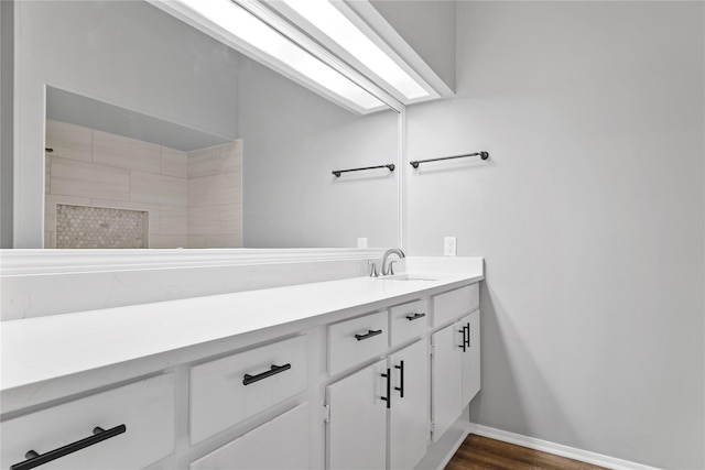 bathroom with vanity and hardwood / wood-style floors