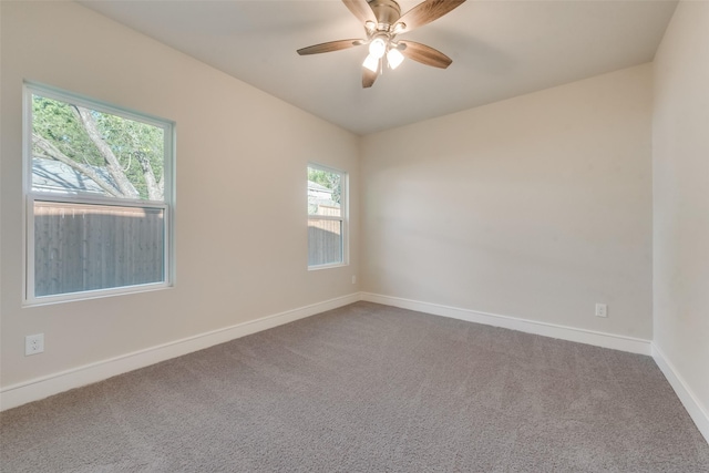 unfurnished room with carpet flooring and ceiling fan