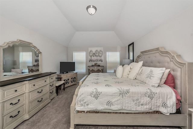 bedroom with vaulted ceiling and light colored carpet