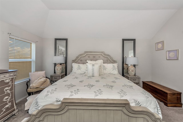 bedroom featuring carpet floors and lofted ceiling