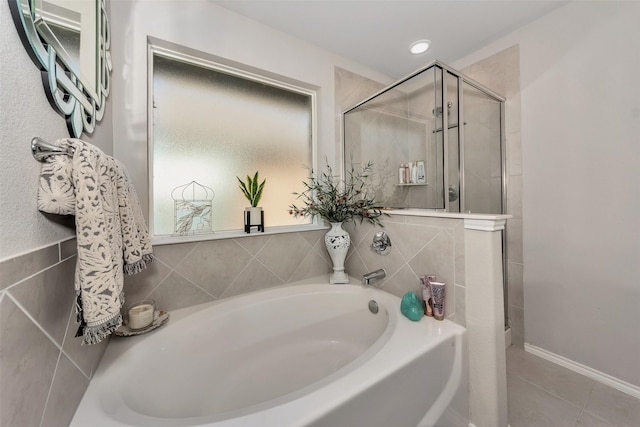 bathroom featuring separate shower and tub and tile patterned flooring