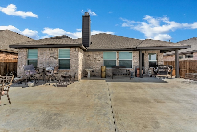 back of property with a patio