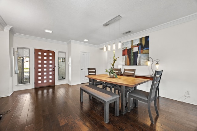 dining space featuring crown molding, dark wood-type flooring, and a textured ceiling