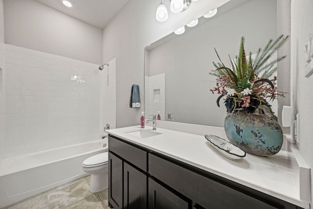 full bathroom featuring toilet, vanity, and tub / shower combination