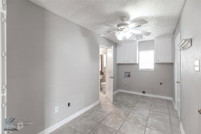 laundry room featuring light tile patterned floors, ceiling fan, electric dryer hookup, hookup for a washing machine, and cabinets