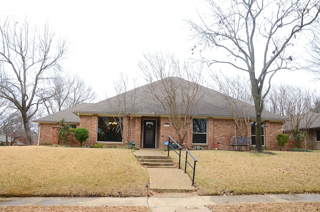 ranch-style home with a front lawn