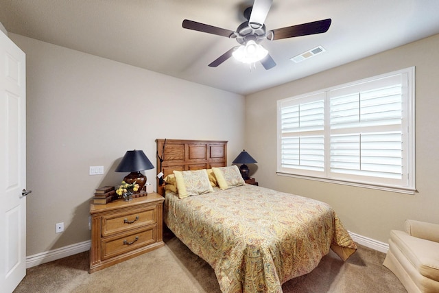 bedroom with light carpet, baseboards, and visible vents