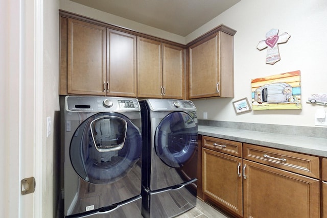 laundry area featuring cabinet space and washing machine and dryer