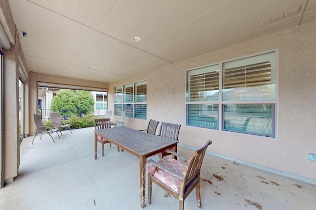 view of patio / terrace featuring outdoor dining space and fence