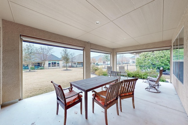 view of patio / terrace featuring outdoor dining area and fence